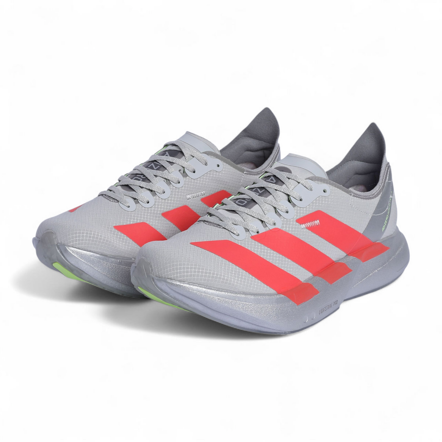 Gray athletic shoes with red stripes on a white background