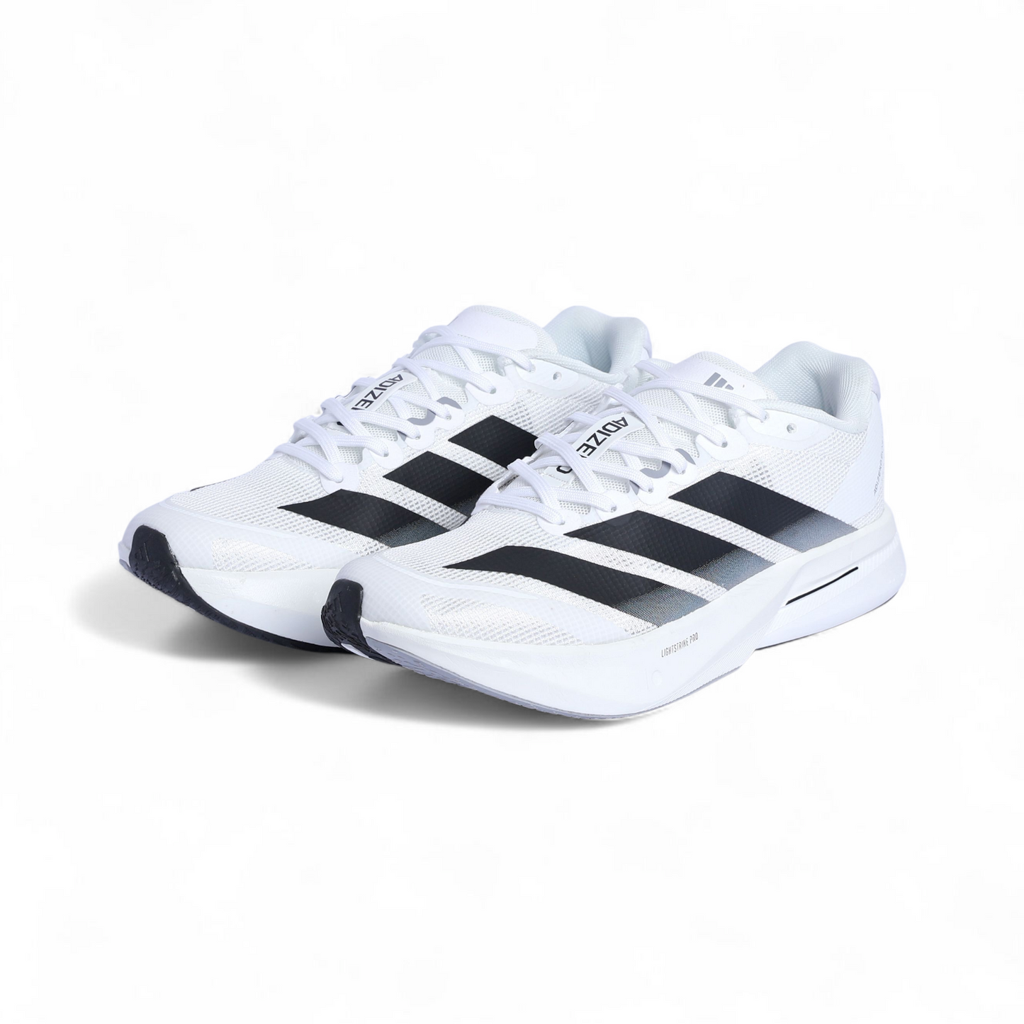 White sneakers with black stripes on a white background