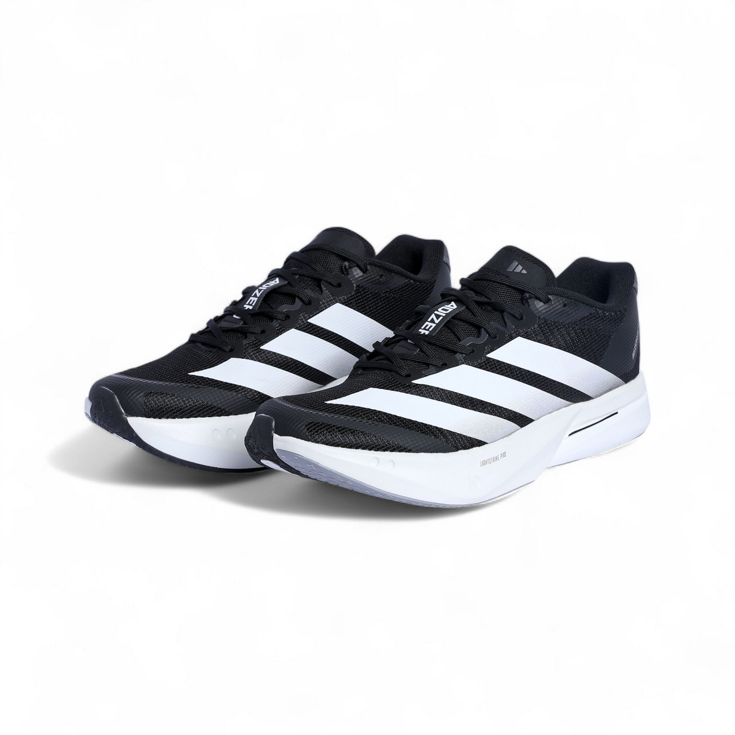 Black and white Adidas sneakers on a white background