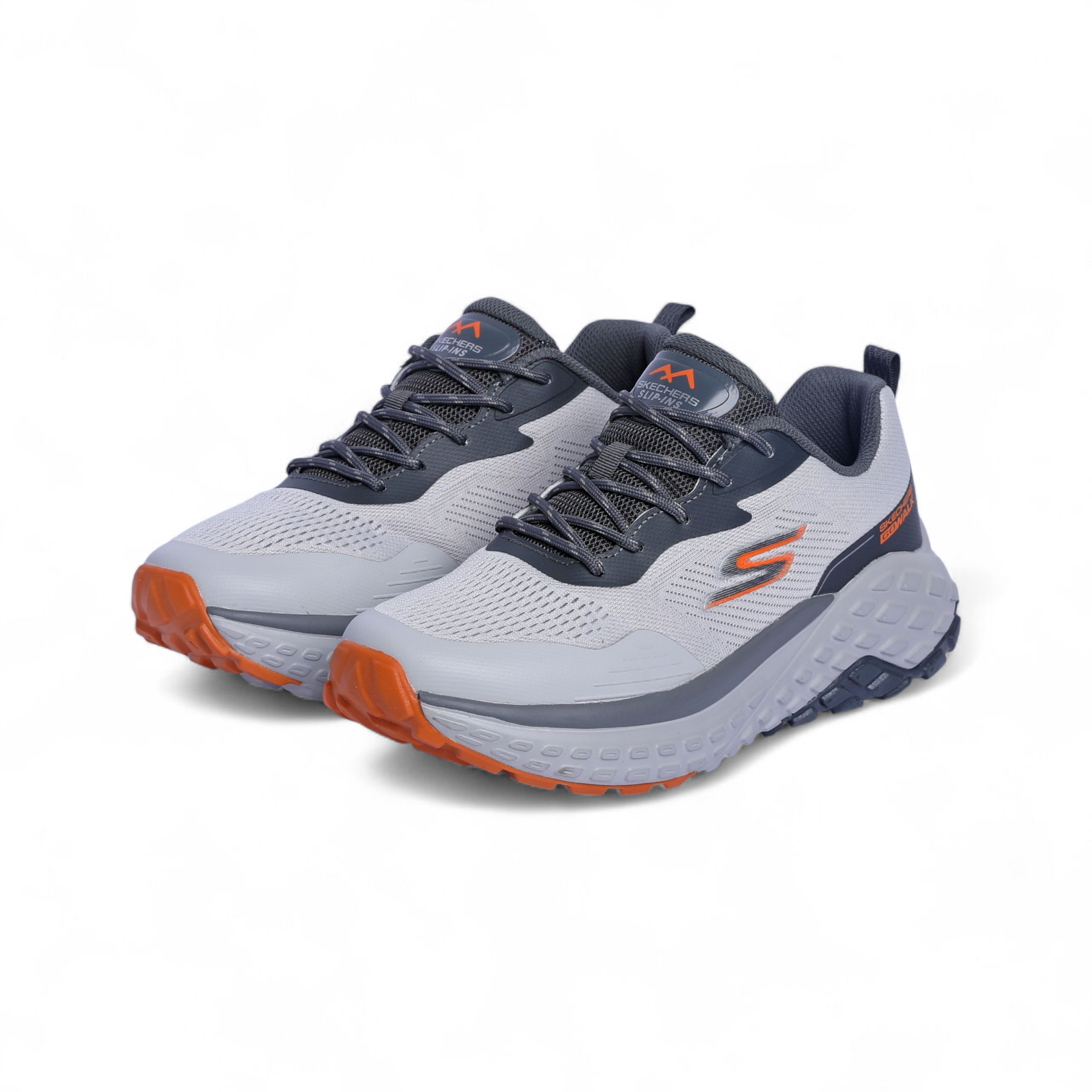Gray and orange running shoes on a white background
