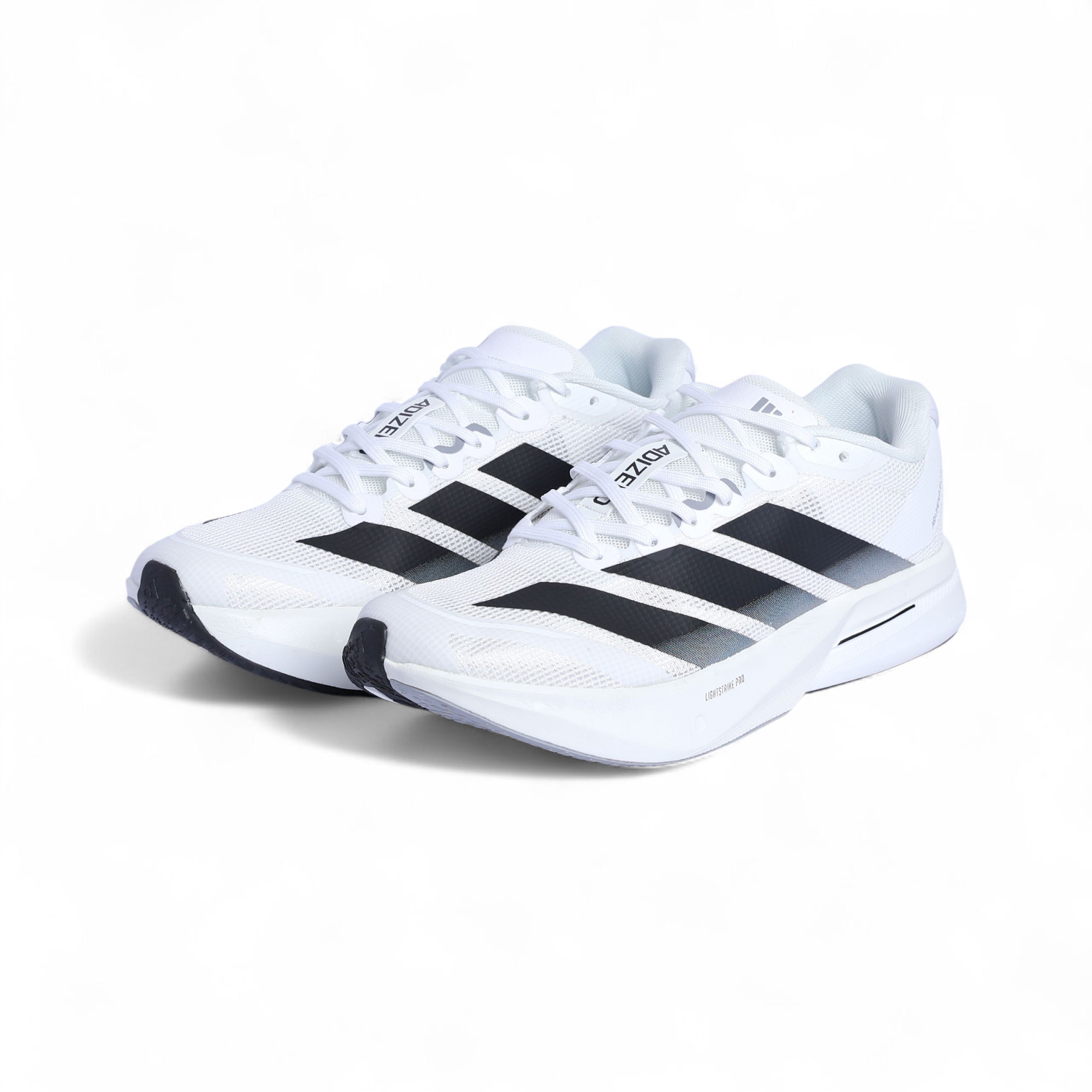 White sneakers with black stripes on a white background